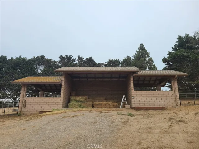 Two more covered horse stalls and covered feed storage area