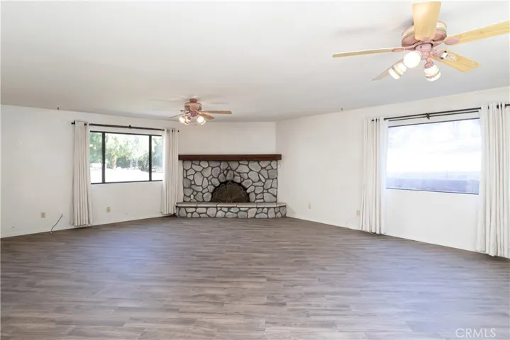 Living room with wood burning fireplace