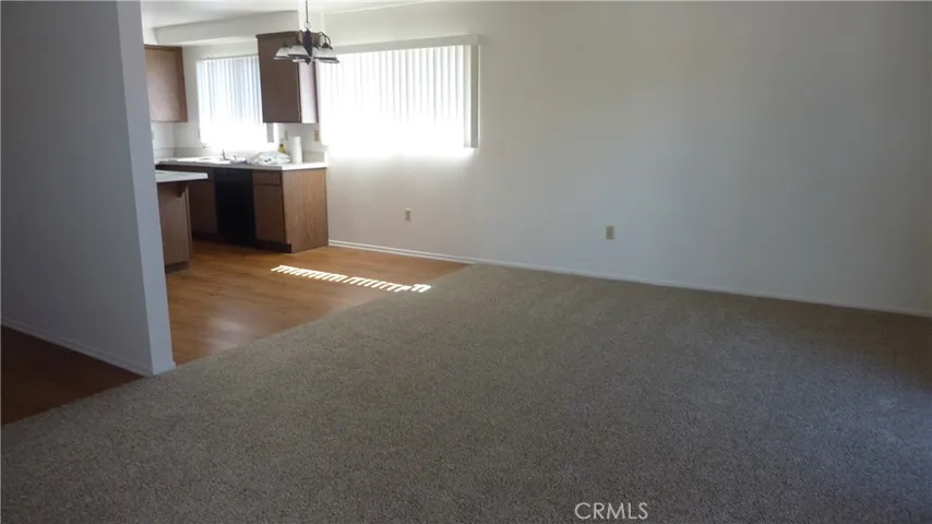 Eating area off carpeted living room.