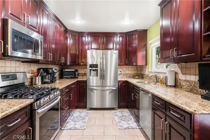 REMODELED KITCHEN WITH STAINLESS STEEL APPLIANCES