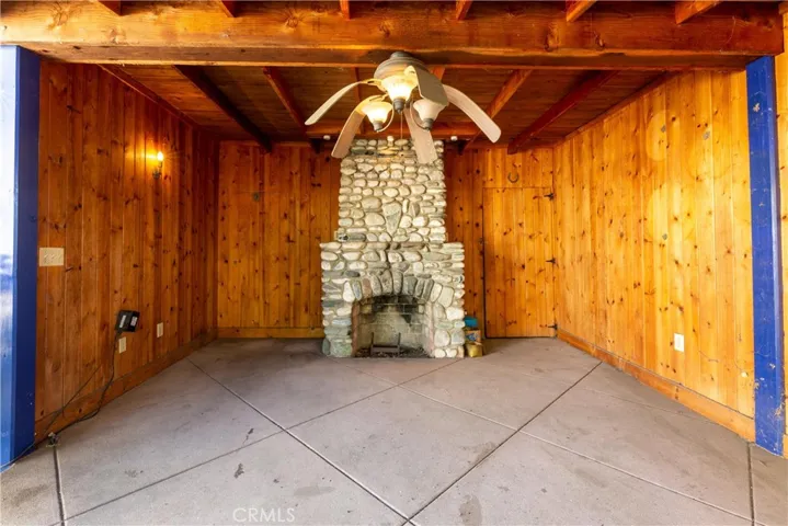 covered patio with fireplace built long ago