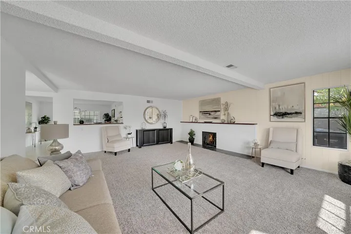 Fabulous gas lit brick fireplace with solid wood mantle