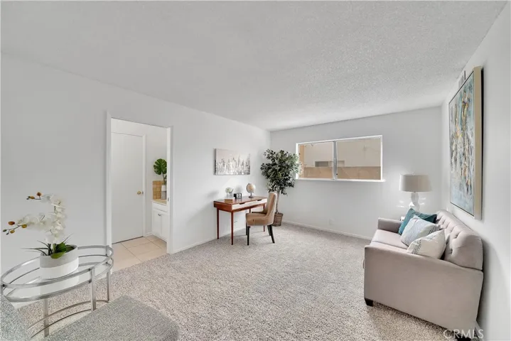 Down stairs guest bedroom no 2 with private half bathroom or make it a den or family room (currently shown as a den)