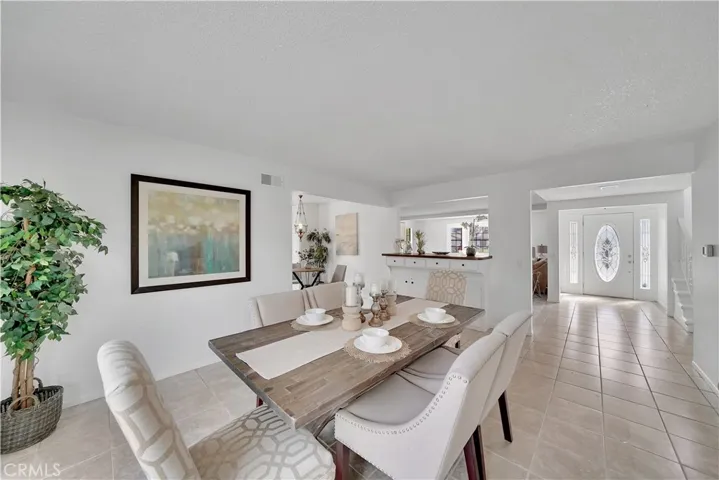 Another view of the dining area with pass through bar area to the living room.