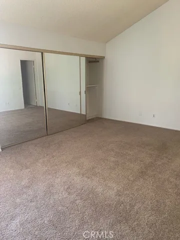 Master bedroom with mirrored closets