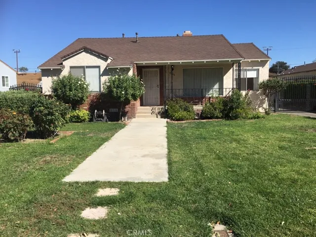 Front of House showing Driveway Gate to Left and Front Porch