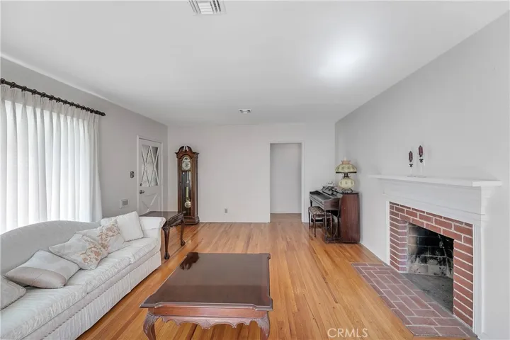 Brick Fireplace with White Framed Mantel