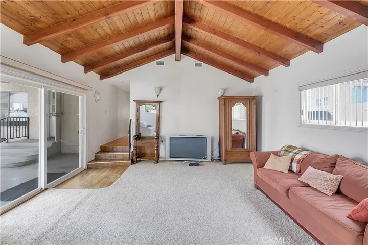 Family Room with Wood Beam Ceilings looking to the Hallway