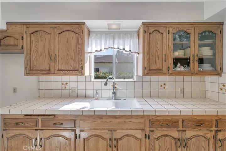Kitchen Sink is Porcelain with Chrome fixtures