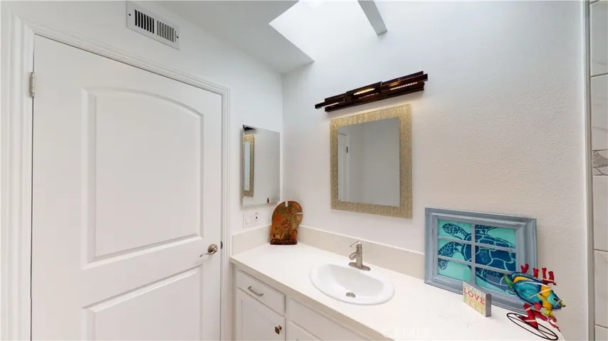 Matching quartz countertops throughout home.  Bluetooth speakers in vanity light fixtures in both bathrooms.
