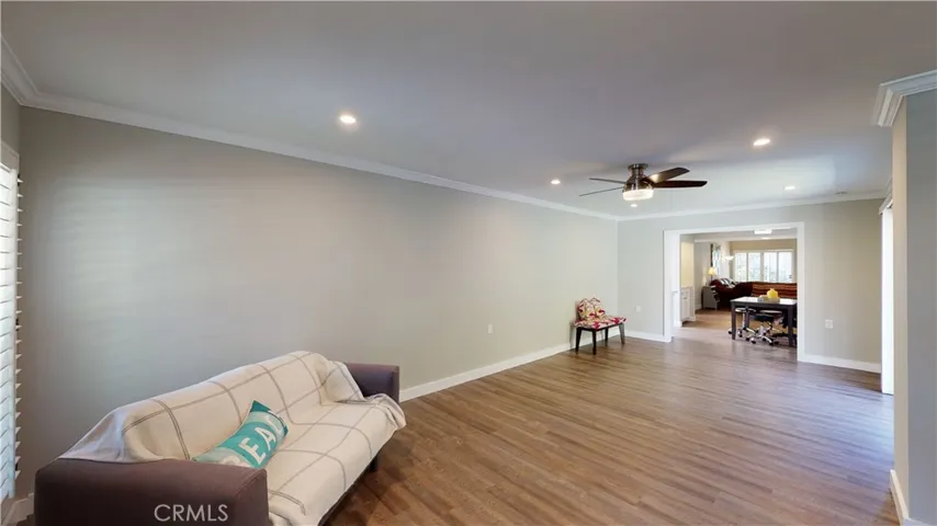 Large family room with ample room for desk area and family room furniture set and room for the grandkids tv or game table area.