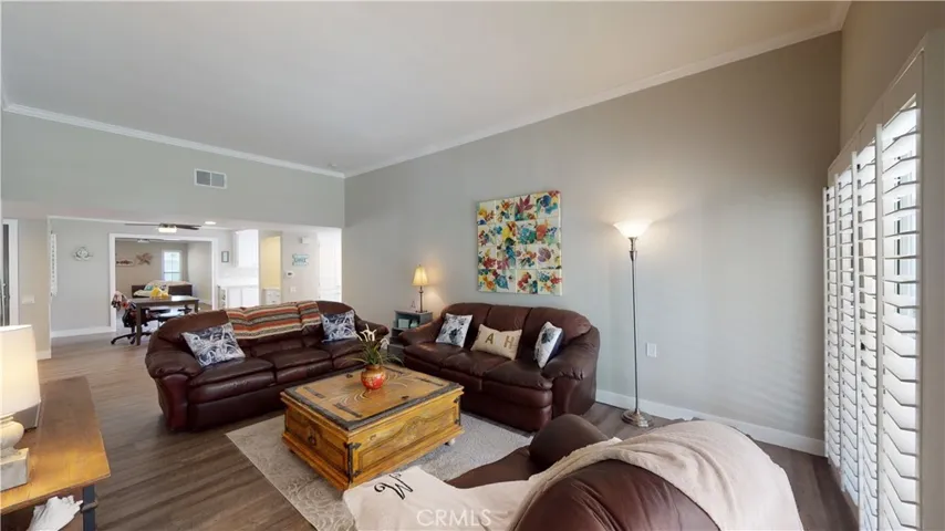 Natural light floods living room from patio windows.