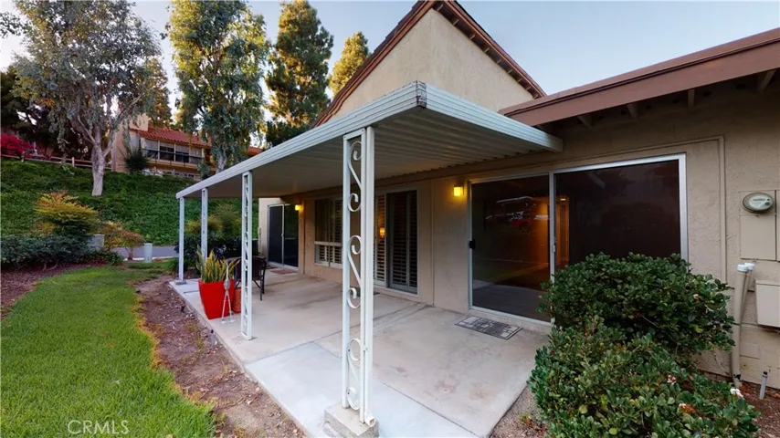 Rear covered private patio to enjoy sipping  on your favorite beverages with friends and family.