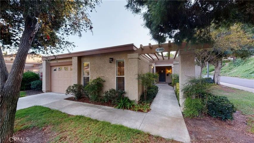 End unit with large front yard and single loaded Bahia Blanca East street due to landscaped upslope across the street.  Makes this condo feel like a detached single-family home.