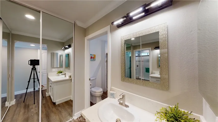 Dual his and hers full length wardrobe closets, all freshly repainted inside with contemporary white trimmed mirrors.
