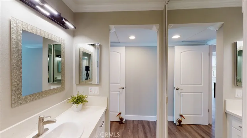 Matching quartz countertops throughout home.  Bluetooth speakers in vanity light fixtures in both bathrooms.