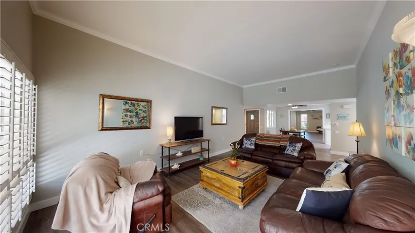 High ceiling living room with new smooth plaster and crown molding