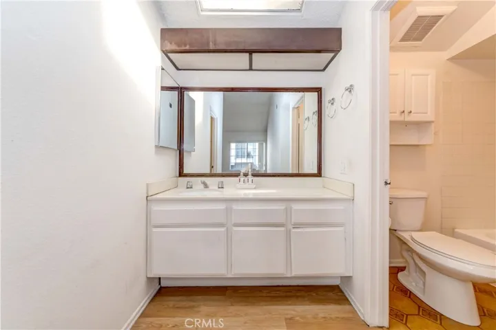 Vanity in larger bedroom