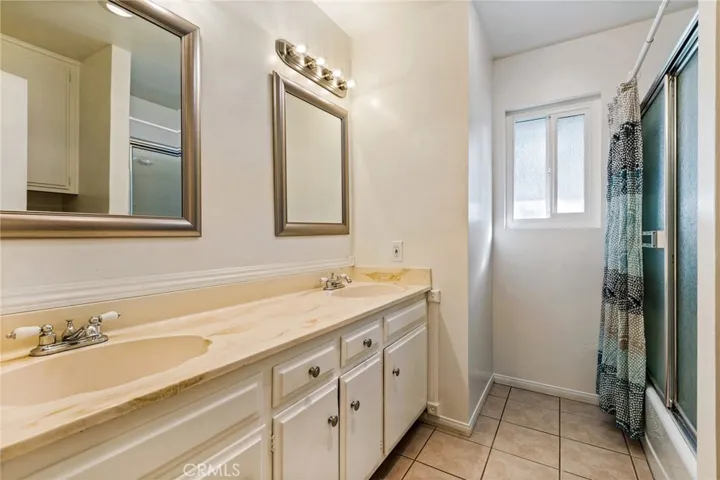 Hall bathroom with dual-sinks