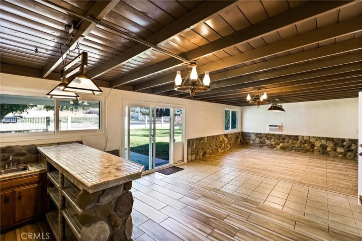 Spacious, open and bright game room overlooking your 2+ acres!
