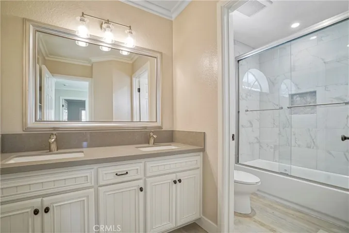 Upstairs Bathroom with dual sinks and new shower and counters