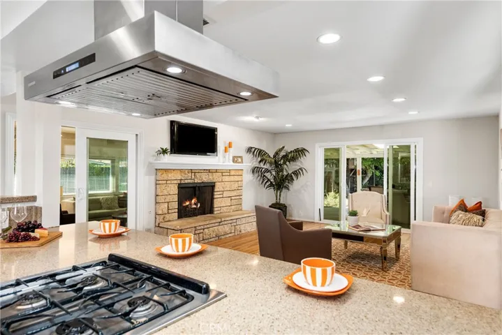 From the foyer, you can see through the kitchen to the formal living room, and right out to the yard.