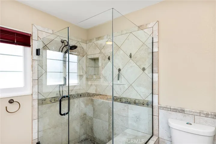 A large walk-in shower awaits you.