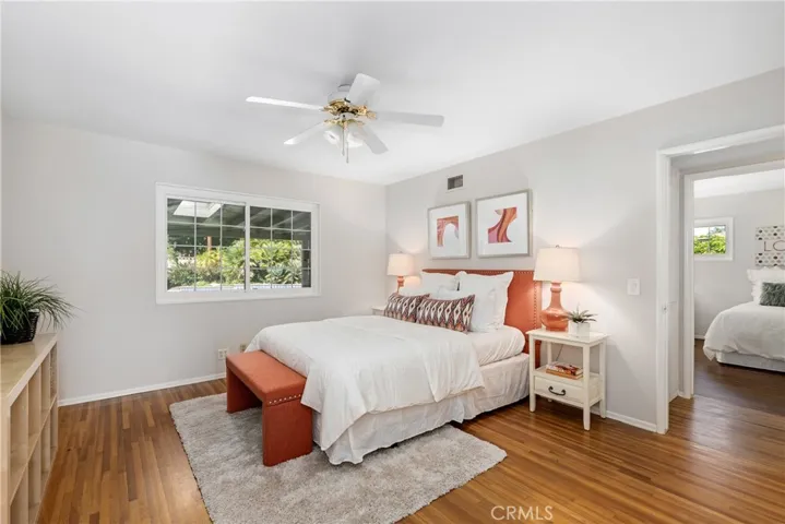 Living room and all bedrooms are oversized and feature original wood floors.