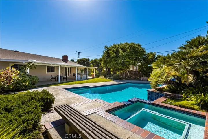 A reverse view towards the house highlights the spa, and water feature into the pool.