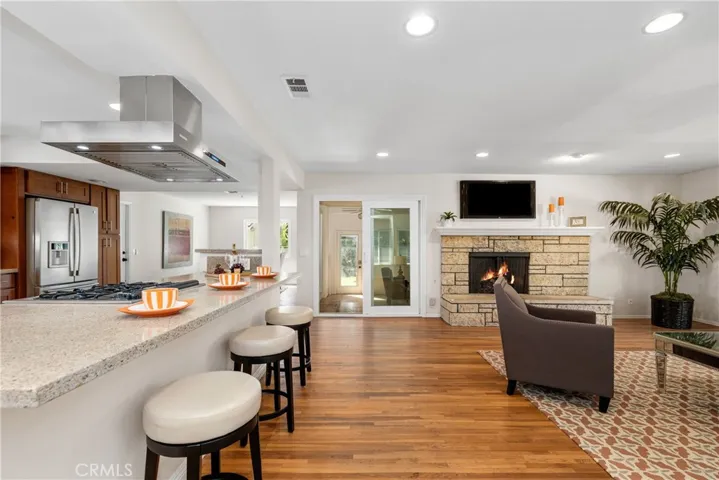 The large island has room for plenty of guests, and easy access to the built-in wine refrigerator.