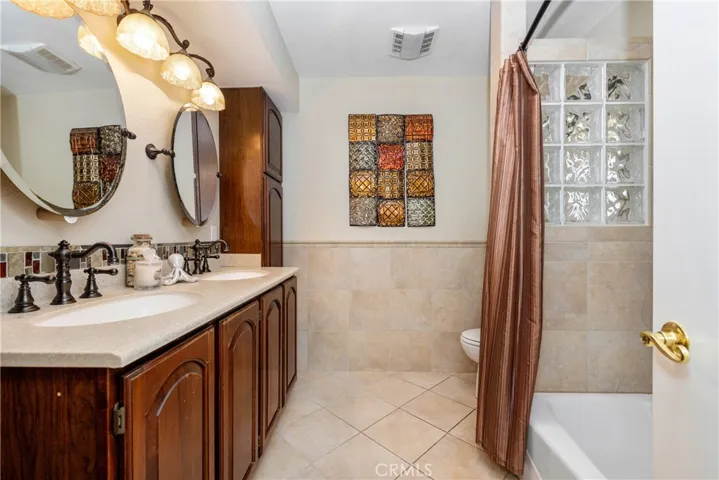 The hall bath features double sinks.
