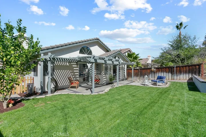 Lemon tree & new sod in rear yard great area for children to play.  A relaxing patio area for BBQ's and family gatherings.