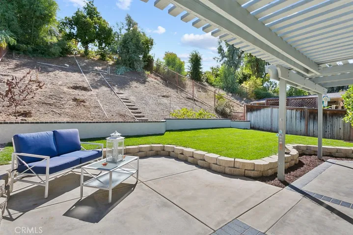 View of your beautiful yard off your primary bedroom from your patio area.