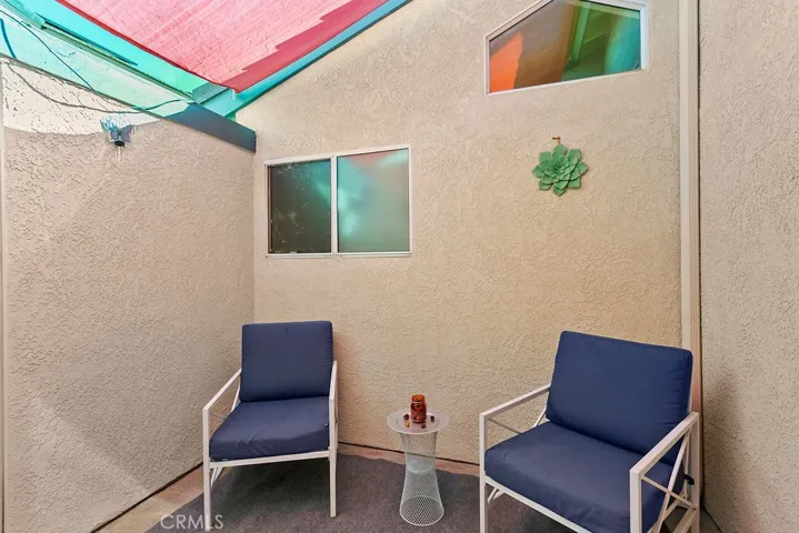 Secondary bedroom private enclosed patio area for relaxing, reading, exercise or a great area for your children to play.