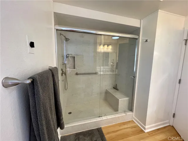 Large remodeled shower with seat in the Owners suite