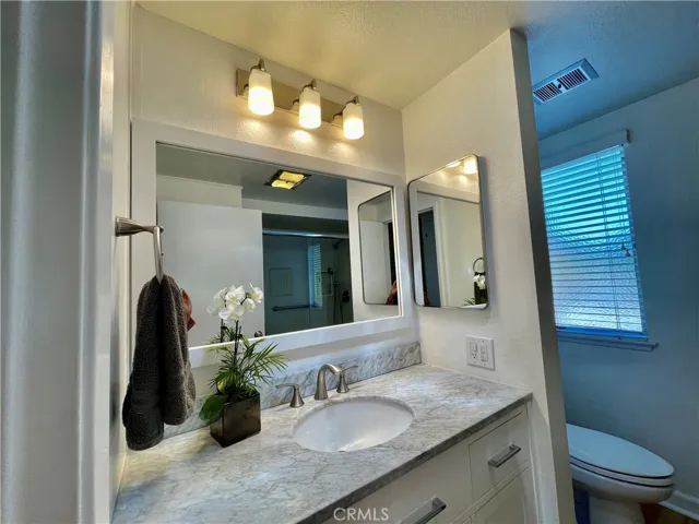 Upgraded master bathroom with granite counters