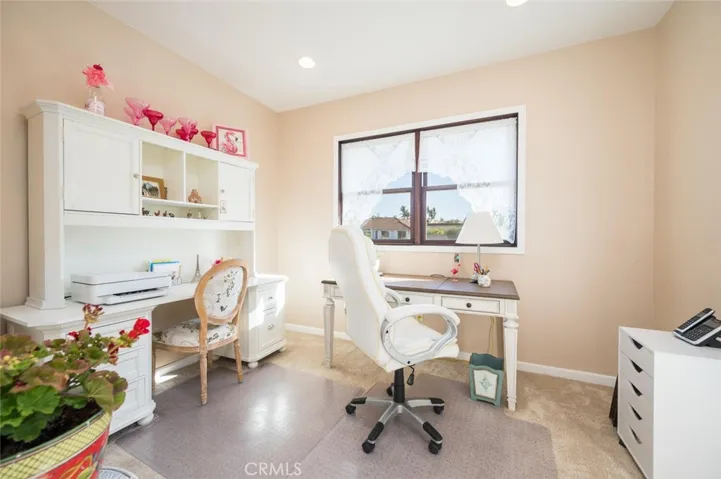 Den/Office off kitchen with doorway to patio