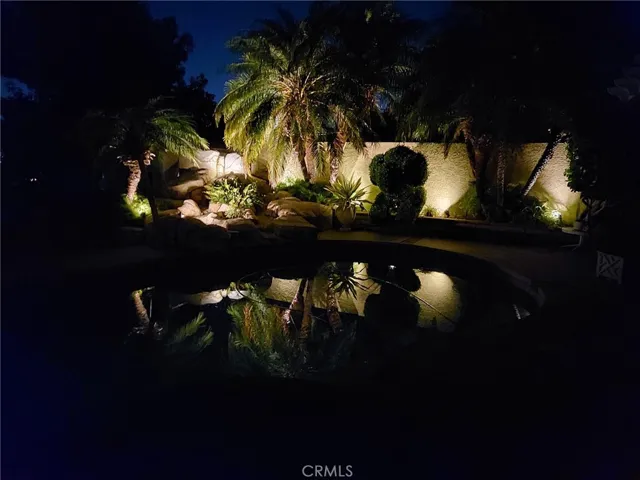 Lighted planter surrounds the Waterfall and pool deck