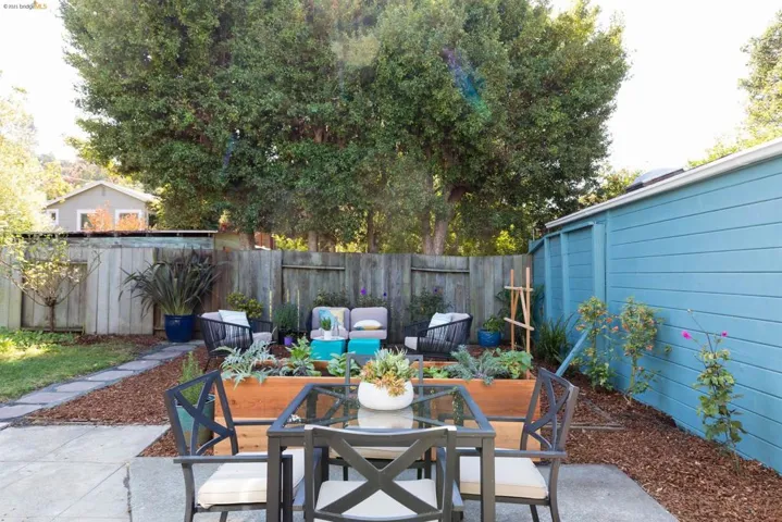 Patio, raised veggie bed, lots of area to play and entertain!