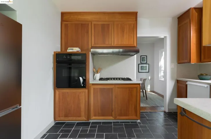 Wall mount oven, separate gas cook top.  Counter depth NEW Beko Fridge built in to the wall.
