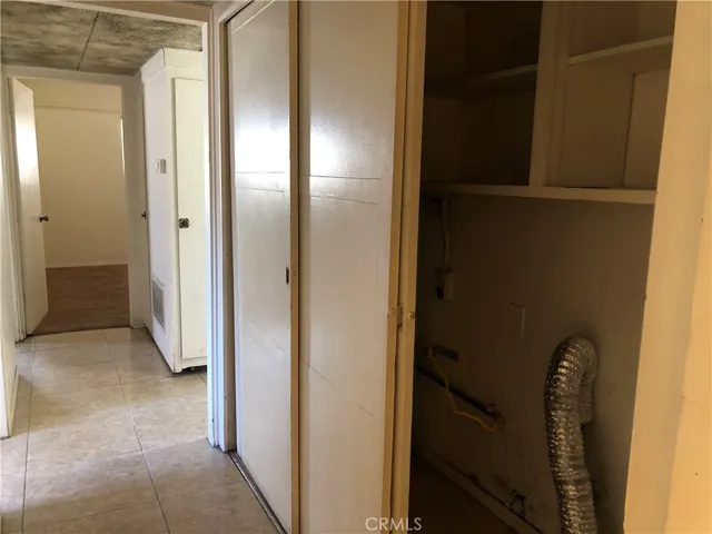 Inside laundry closet on the hallway.