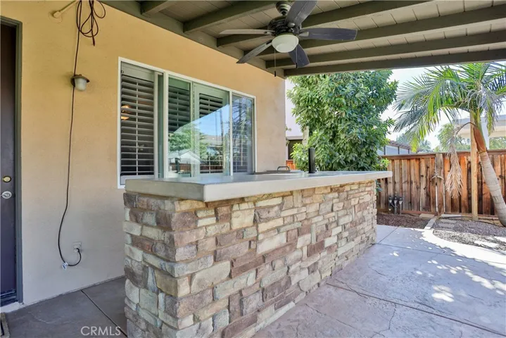 Outdoor bar/kitchen with sink and kegerator