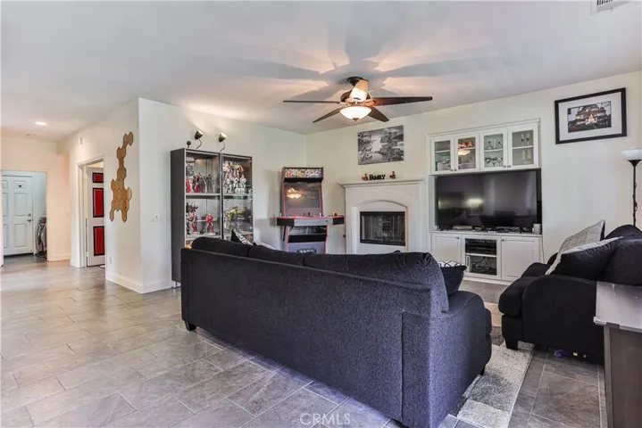 Family room with built-in cabinetry and cozy fireplace