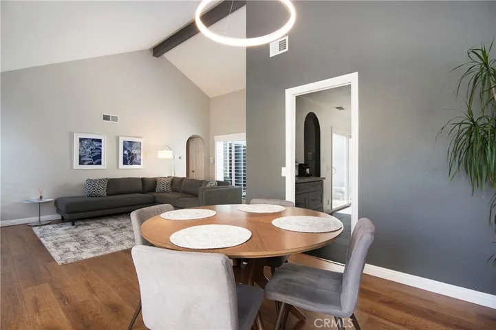 Beautiful open floor plan with stunning beam on cathedral ceiling.