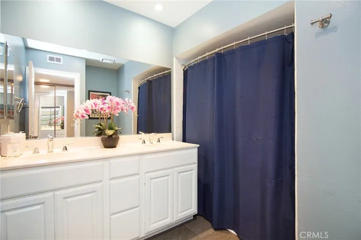 Master Bath with Dual Sinks with Tub/Shower.
