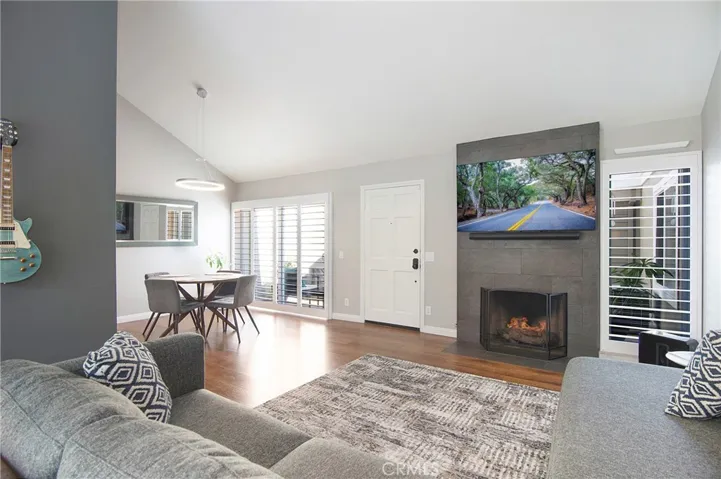 Stunning fireplace with gas logs and plug for TV.