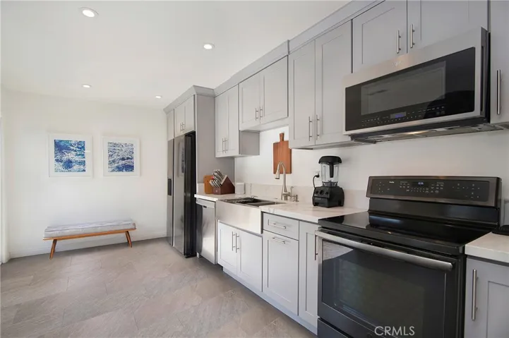 Stainless appliances including induction oven.