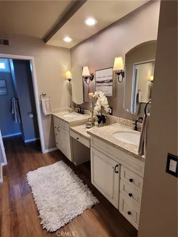 Master bathroom. Double sinks and vanity area in the middle.