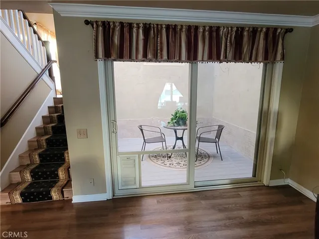 Double paned sliding glass door and doggy door access to atrium.