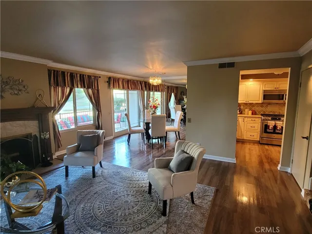 Living room with view of kitchen and dining area.